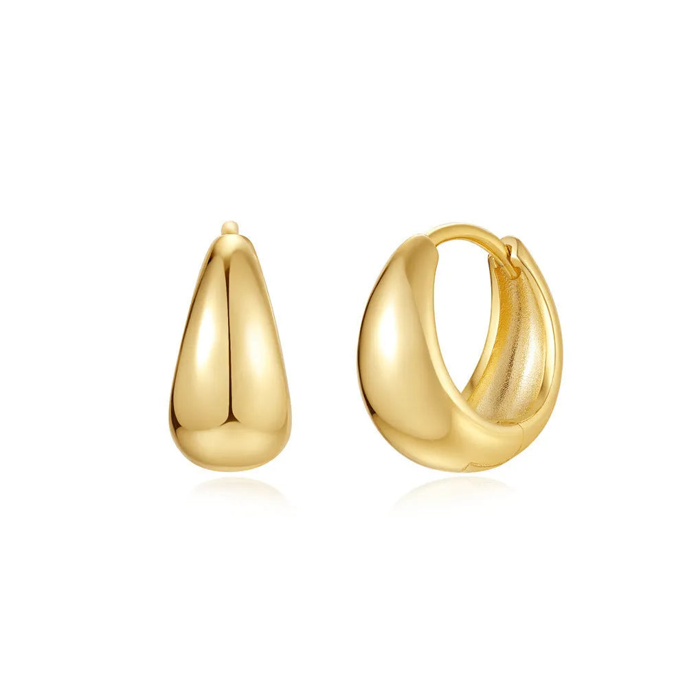 Gold tone brass diamond earclip earrings with geometric round shape and European styling