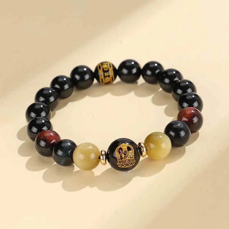 Handmade black agate bracelet with zodiac animal charms and gold tiger eye beads on wrist