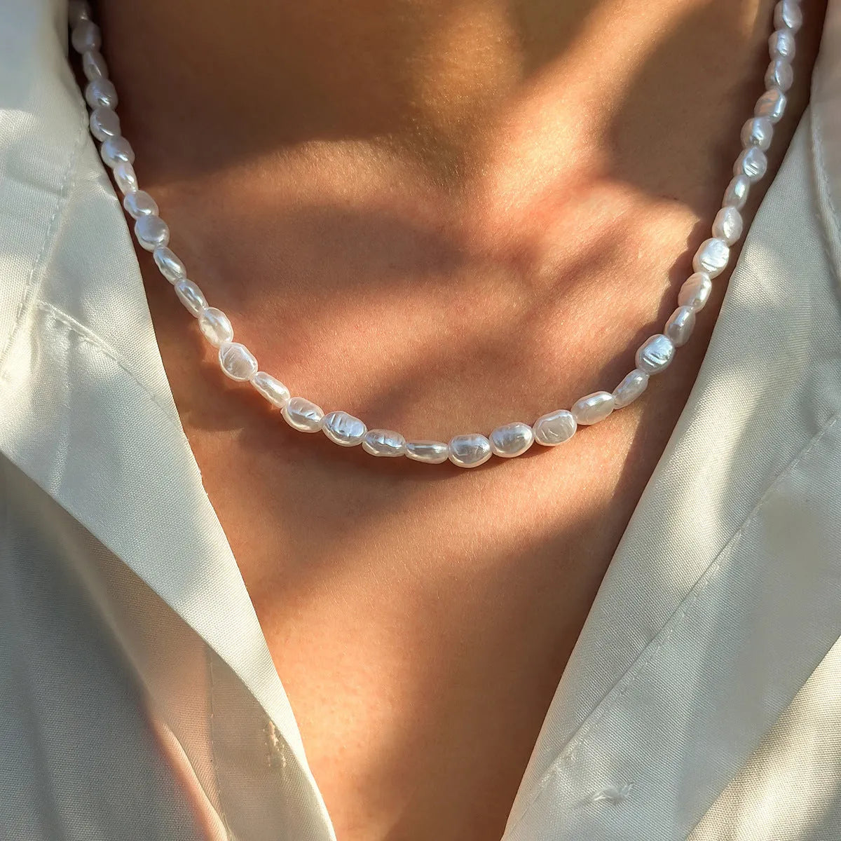 Men's white U-shaped Mother Pearl necklace on imitation pearl chain, adjustable 41-50cm length.