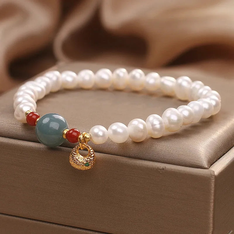 White freshwater pearl and aquamarine bracelet with opal centrepiece, ethnic style