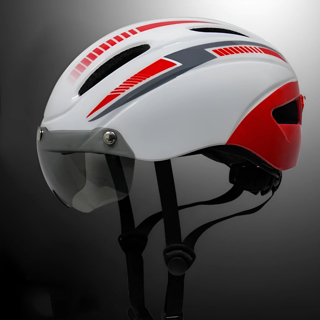Adult bicycle helmet with integrated red taillight on the rear, shown in a black and blue colour variant.