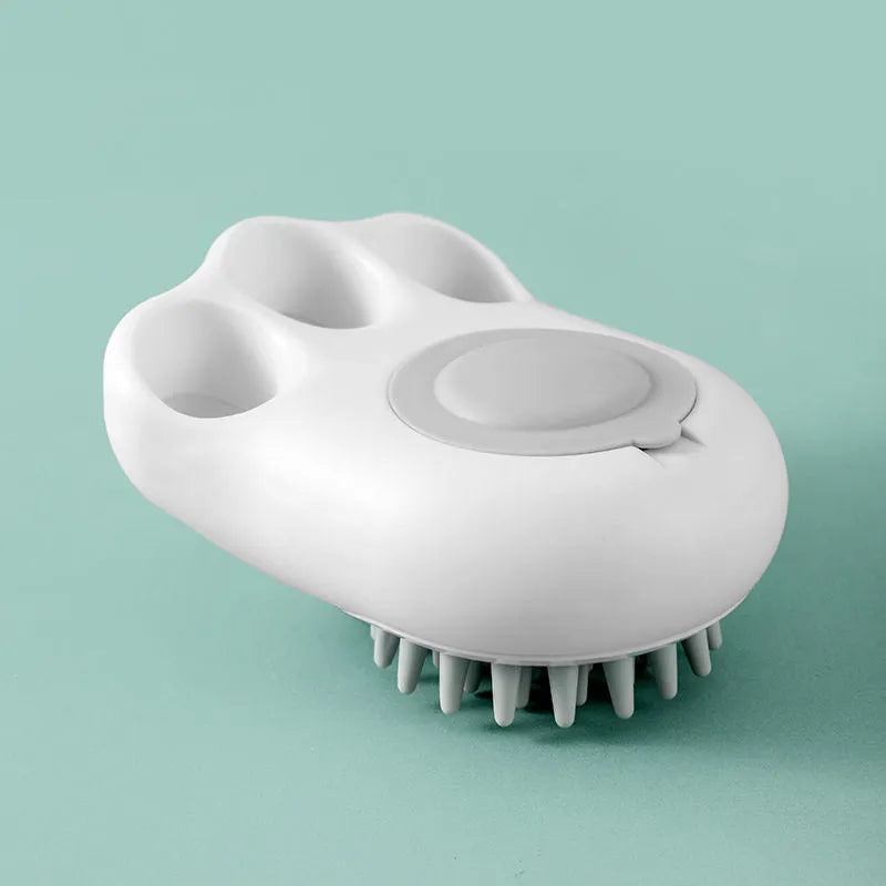 Blue silicone claw pet bath brush with non-slip handle for dog and cat grooming.