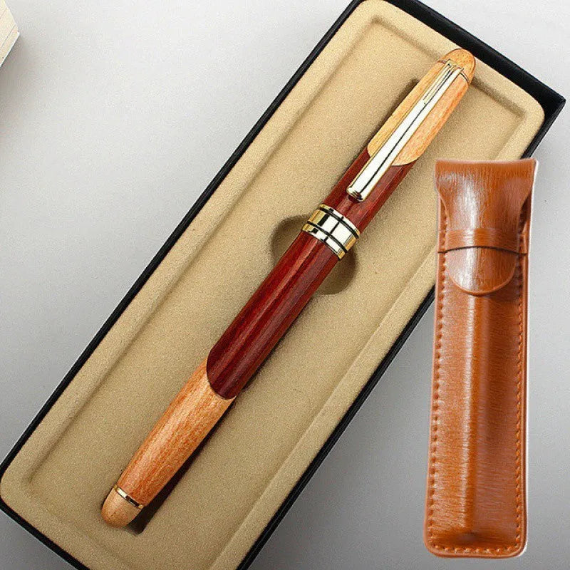 Wooden ballpoint pen with metal details shown alongside its grey fabric carrying bag.