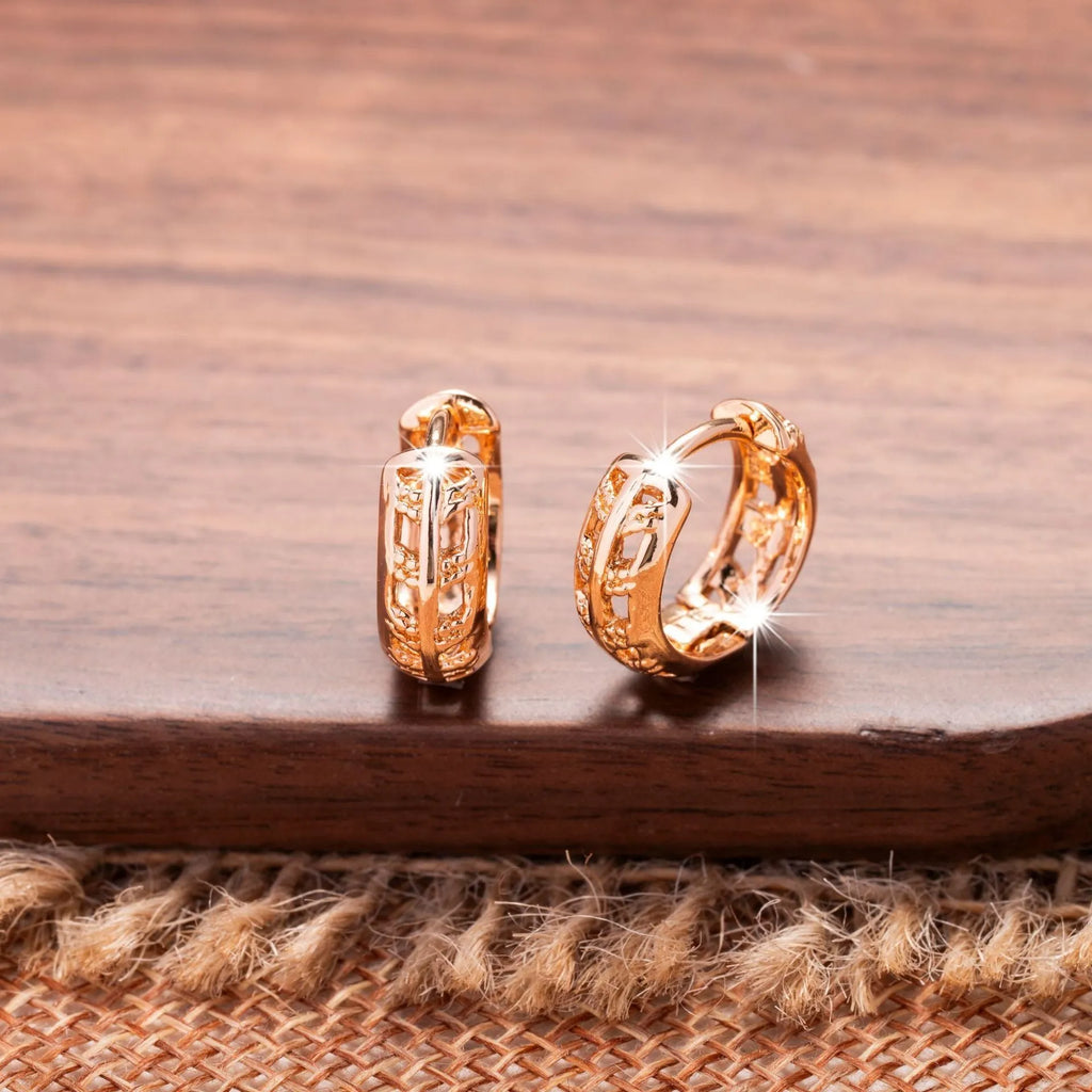 Rose gold copper earrings with hollowed-out leaf design featuring heart shape details
