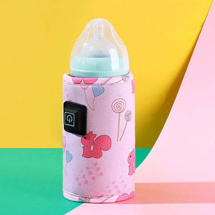 USB baby bottle warmer in a blue dinosaur patterned composite velvet insulating cover.