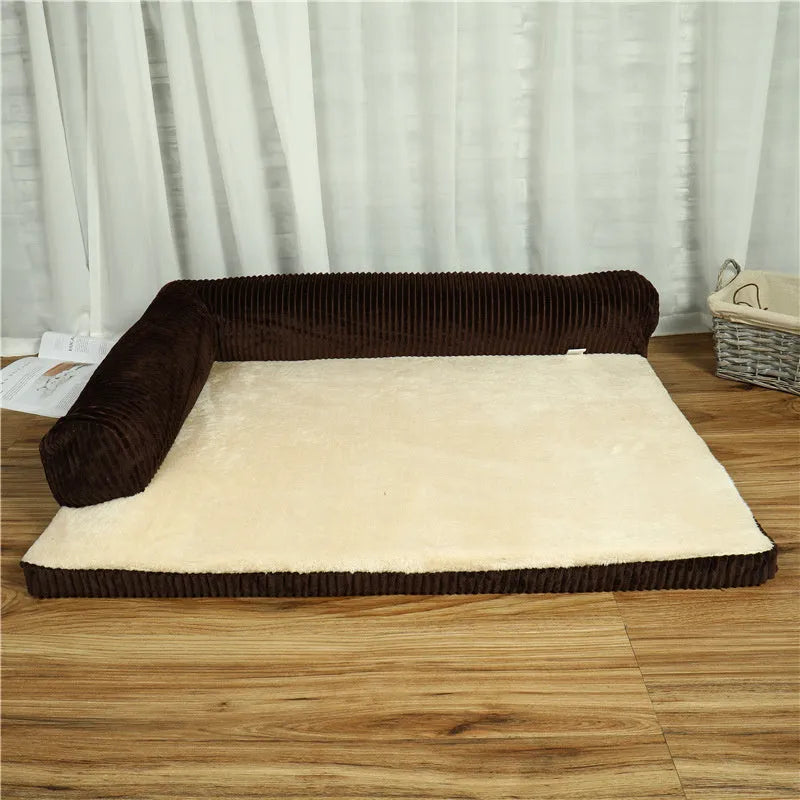 A corduroy pet sofa dog bed with bolsters, shown in a grey colour, placed on a hardwood floor.
