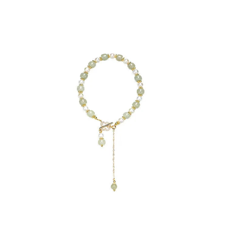 Women's bracelet with round Hetian jade pendant on gold-tone electroplated chain, Chinese-style design