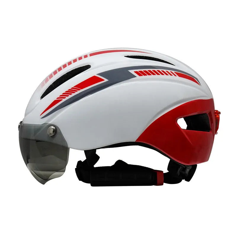 Adult bicycle helmet with integrated red taillight on the rear, shown in a black and blue colour variant.