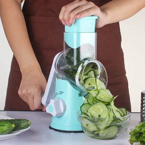 Blue manual mandoline vegetable slicer with stainless steel blade on a kitchen counter.