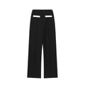 Women's beaded leather top and high-waisted stretch trouser suit in street fashion style