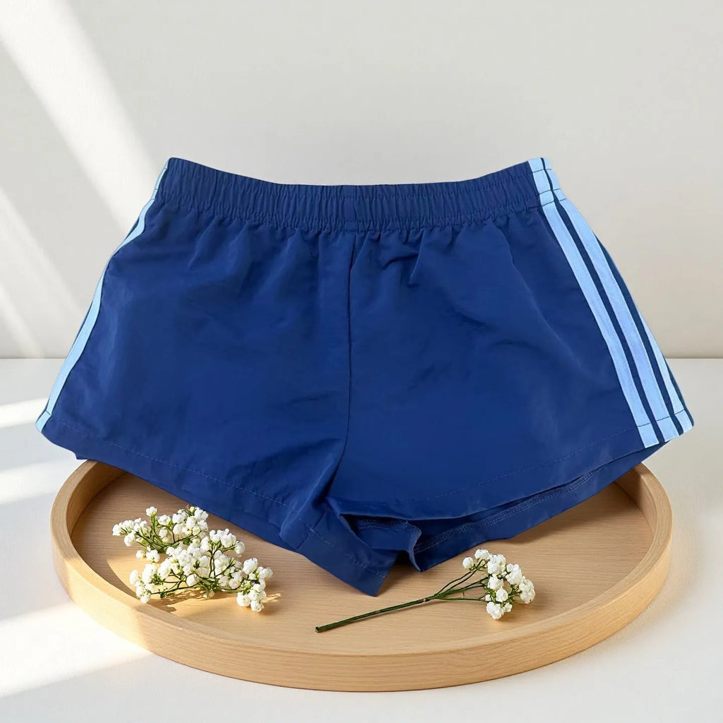 Men's navy blue nylon sport shorts with high-waist elastic waistband