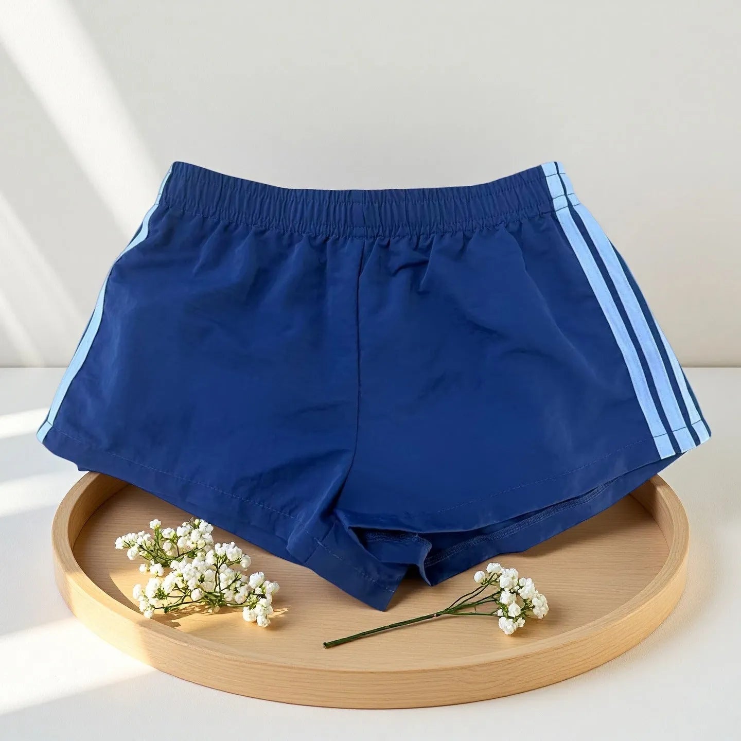Men's navy blue nylon sport shorts with high-waist elastic waistband