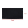Large black felt desk mat with sewn edges, measuring 325x635mm, on an office desk with a keyboard and mouse.