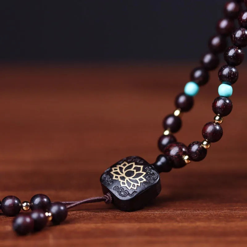 Zambian rosewood bead bracelet with 108 flat lotus pendant beads measuring 0.6 cm each