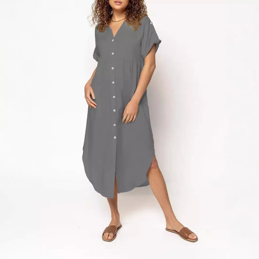 Loose fit solid colour midi dress with decorative buttons on a hanger
