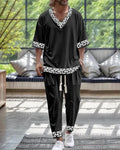 Casual trousers suit with V-neck cropped sleeve jacket and matching trousers in thin polyester.