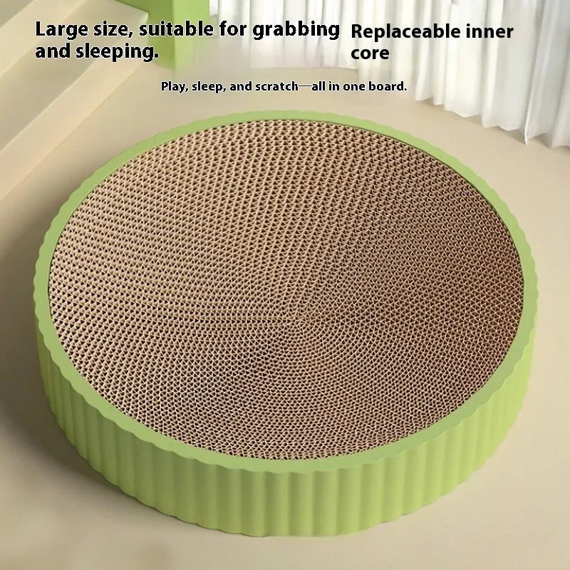 Round green cat scratching board nest with corrugated cardboard surface and two spare refills.