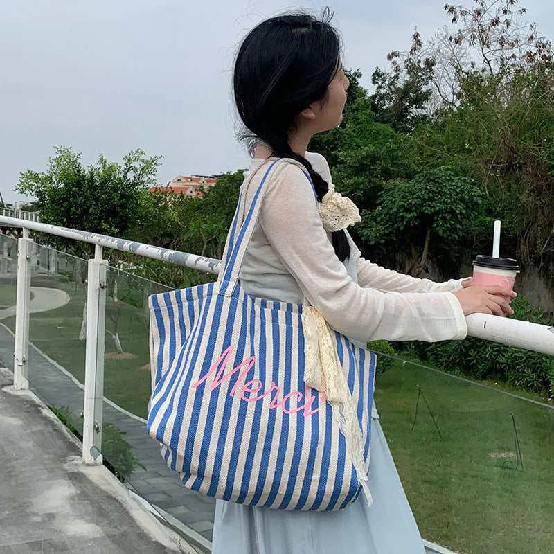 Blue and white striped cotton canvas bag with printed letters in a fresh, sweet style.