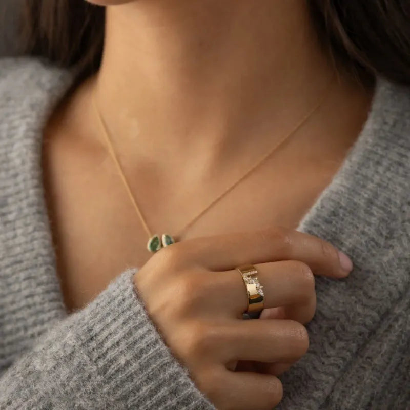 Gold-colour women's ring with shining zircon stone on copper band