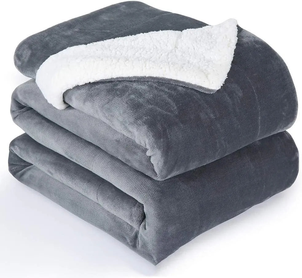 Grey USB electric heating blanket with temperature controls on soft flannel fabric.