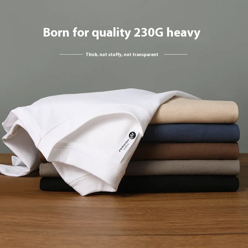 Heavy 230g cotton blend drop shoulder t-shirt in a solid colour, showing loose fit and short sleeves.