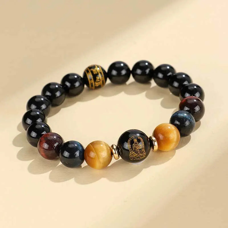 Handmade black agate bracelet with zodiac animal charms and gold tiger eye beads on wrist