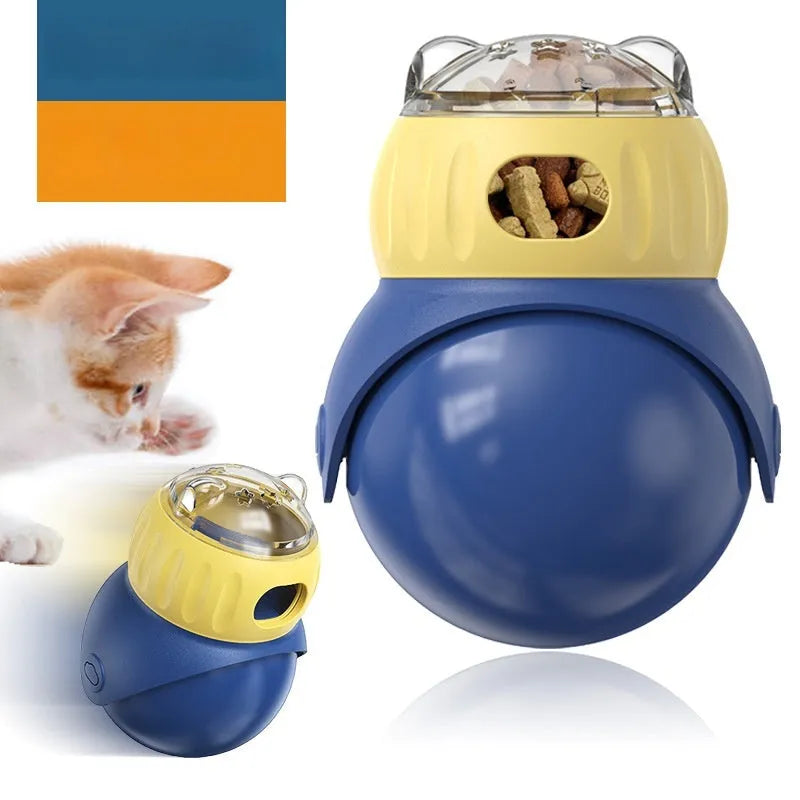 Yellow and blue plastic owl-shaped tumbler puzzle feeder cat toy on a flat surface.