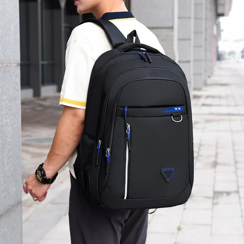 Men's Oxford cloth schoolbag in black with letter pattern showing air pillow belt and large capacity design