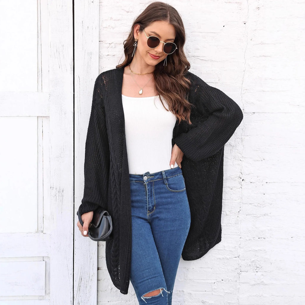 Women's loose-fit acrylic sweater coat in a solid colour, shown in light grey.