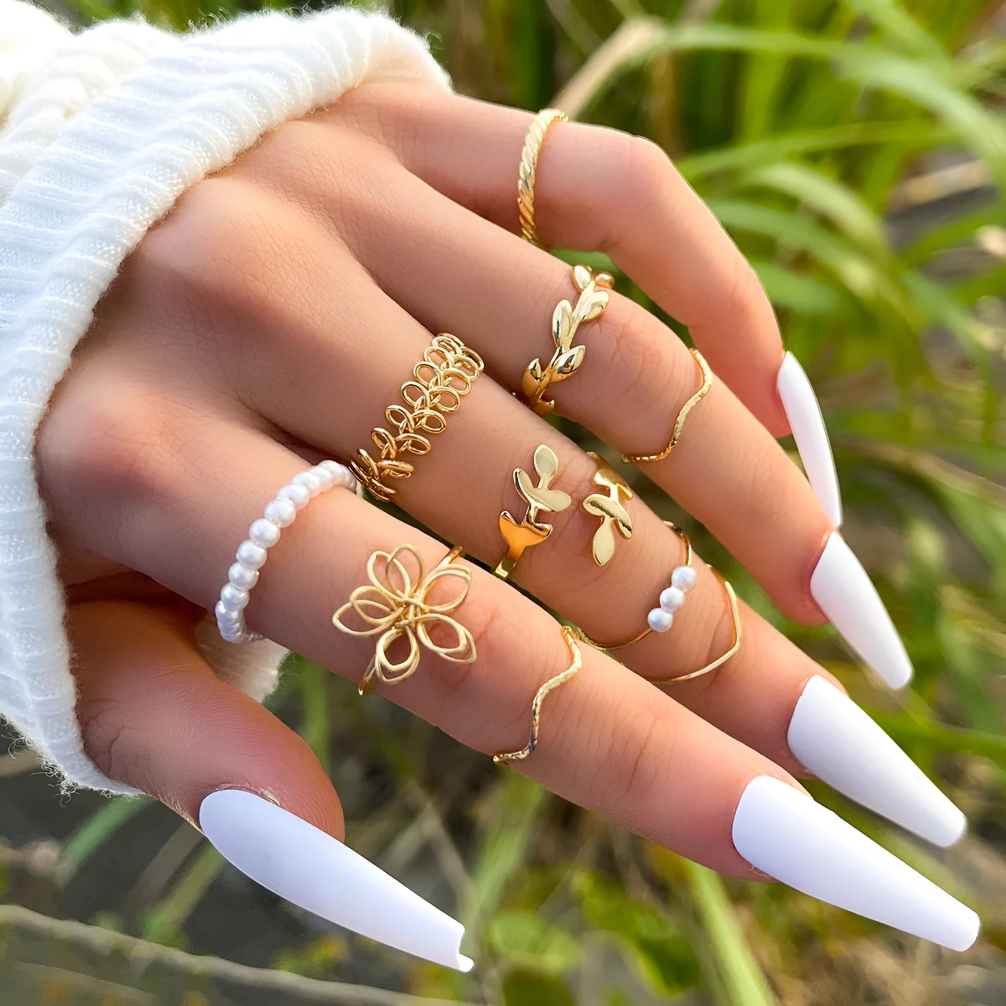 Gold-coloured openwork flower ring made from alloy with a glossy electroplated finish.