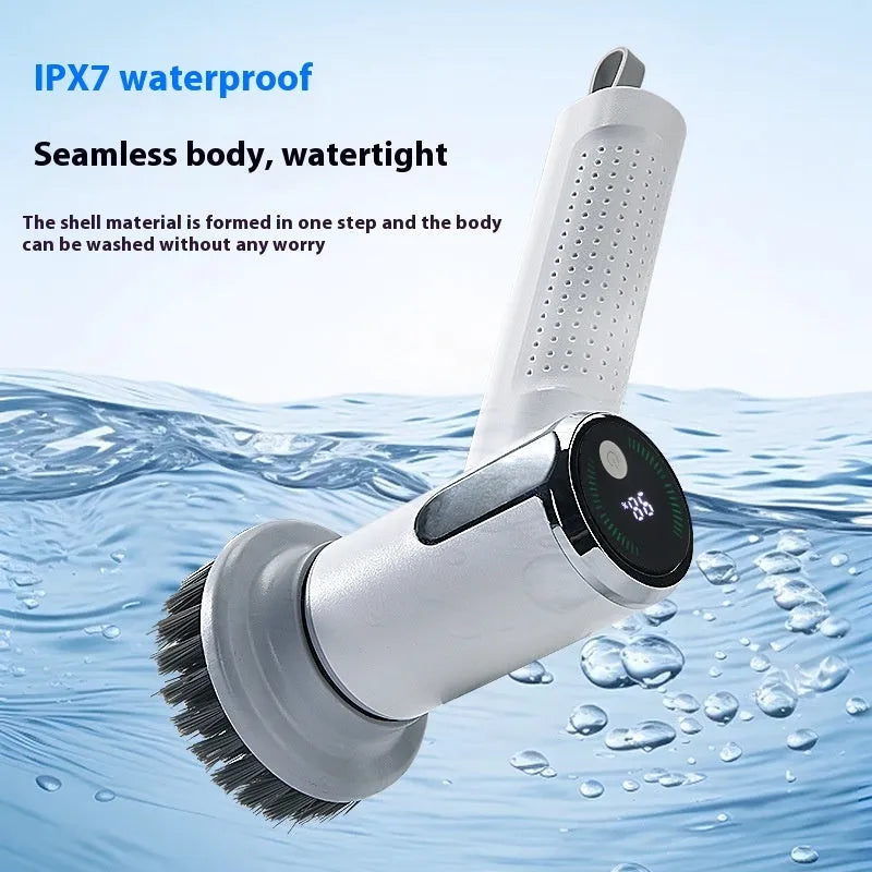 White wireless electric cleaning brush with replaceable head on a kitchen counter