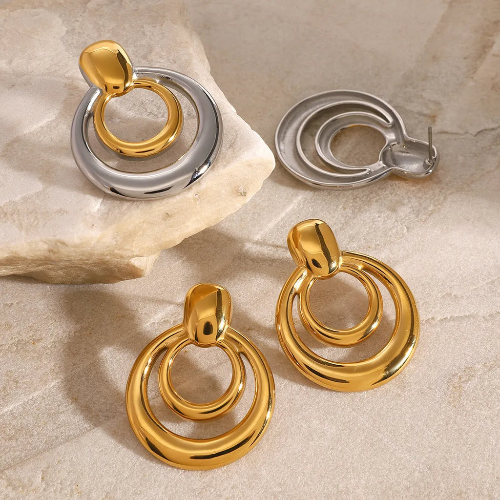 Golden round double-layer hollow stud earrings with 18K gold plating on titanium steel