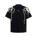 Black loose fit t-shirt with rivet ribbon detail on padded shoulders