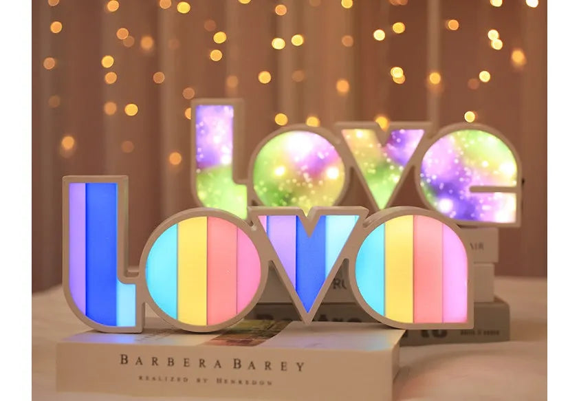 Rainbow style LOVE word LED decorative light with USB cable, measuring 35.5cm by 13.5cm.