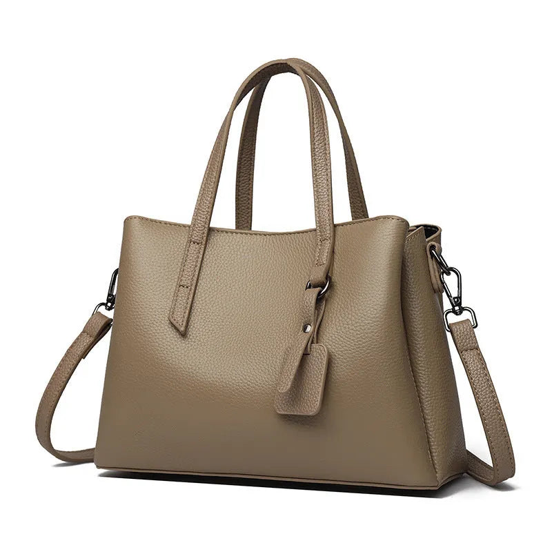 Women's cowhide leather shoulder handbag in horizontal square design with internal compartments