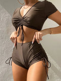 Women's lace-up bow swimsuit in dark green colour, two-piece design with top and shorts