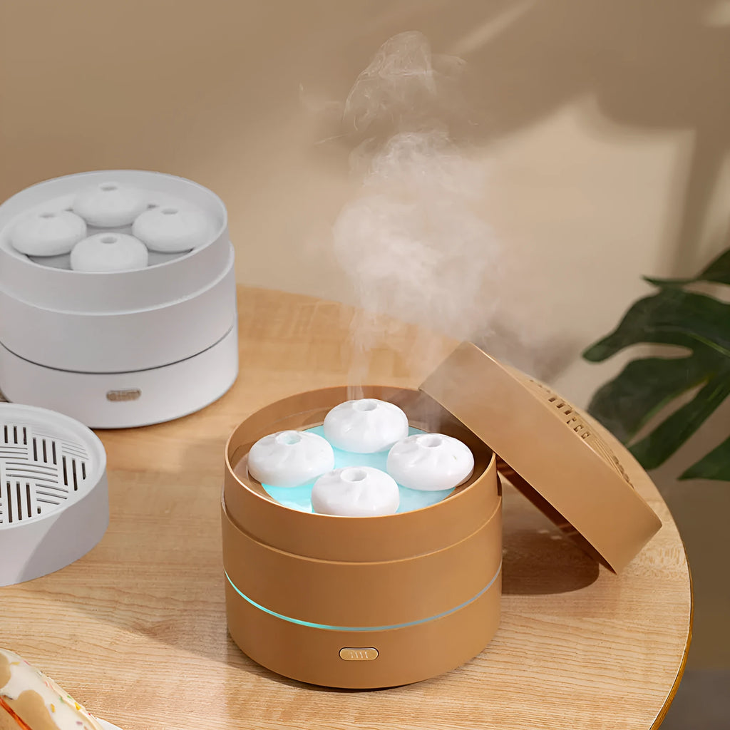 Coffee coloured aroma diffuser with four spray nozzles and LED light display