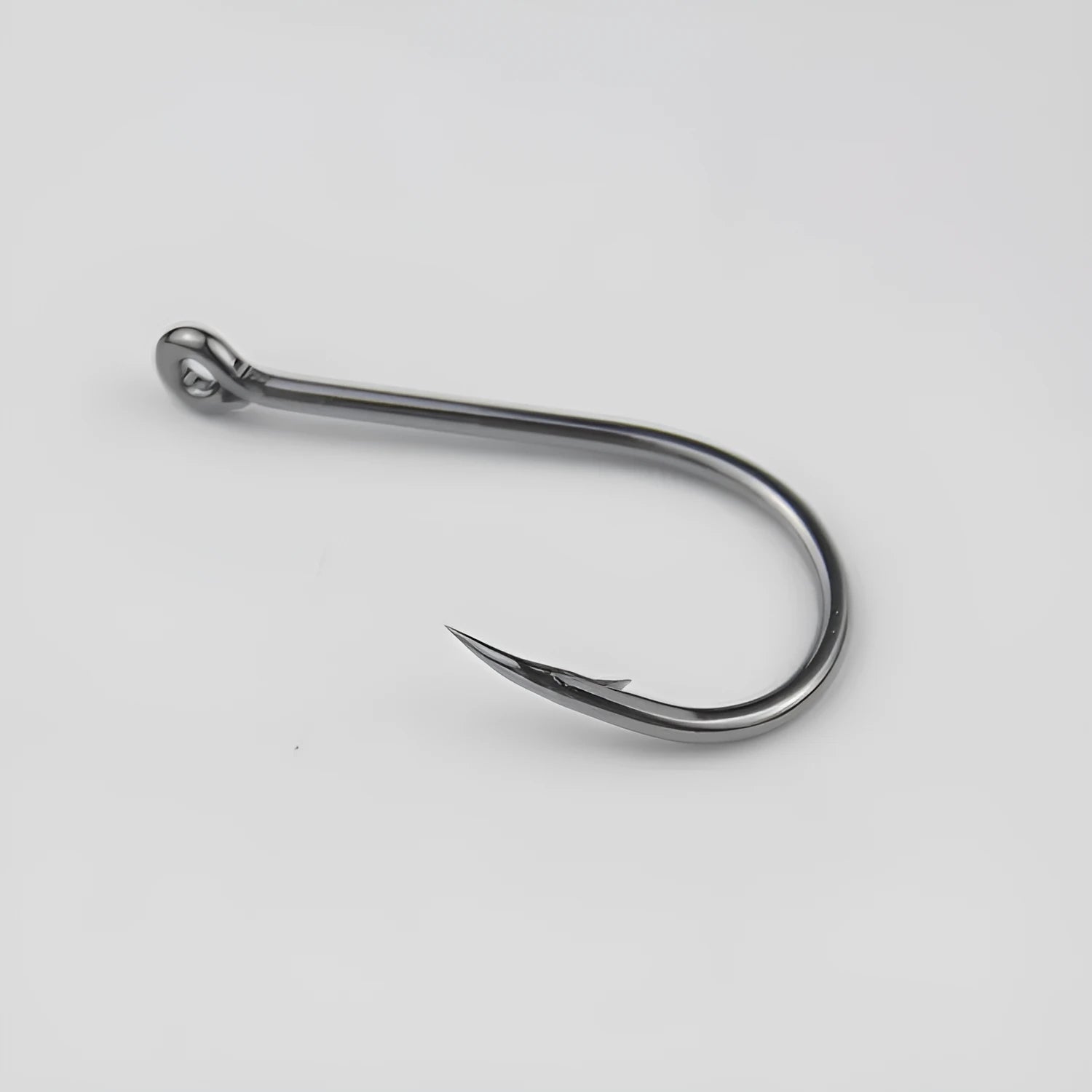 Bulk pack of barbed alloy carbon steel fishing hooks for sea and rock fishing in various sizes.