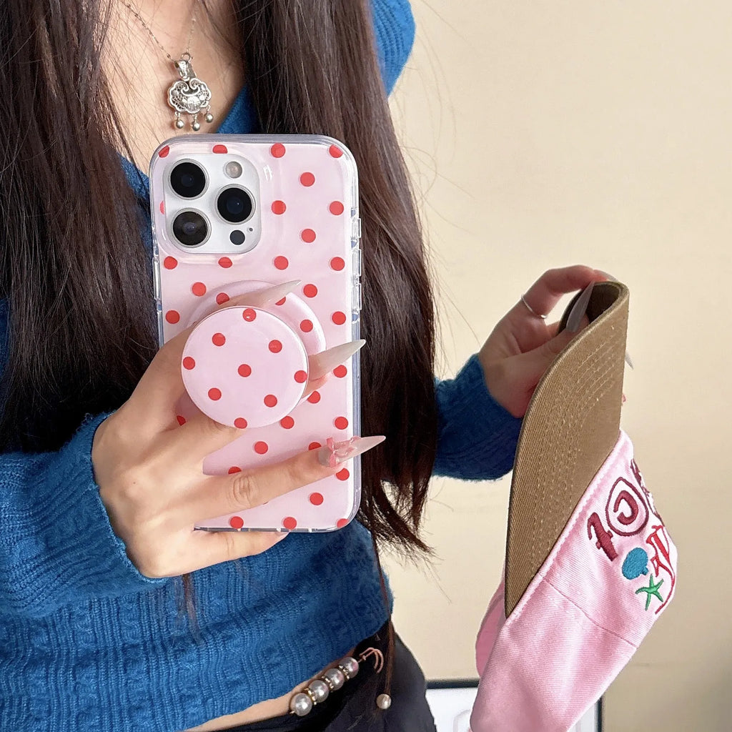 Polka dot phone case with magnetic bracket for iPhone in black showing kickstand
