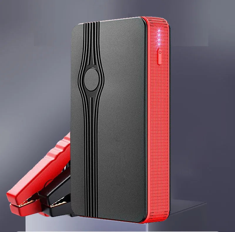 Red K4-E portable car jump starter and power bank unit with USB port and display.