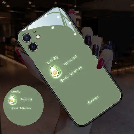 White iPhone case with painted purple daisies and voice-activated colour lights on the back.