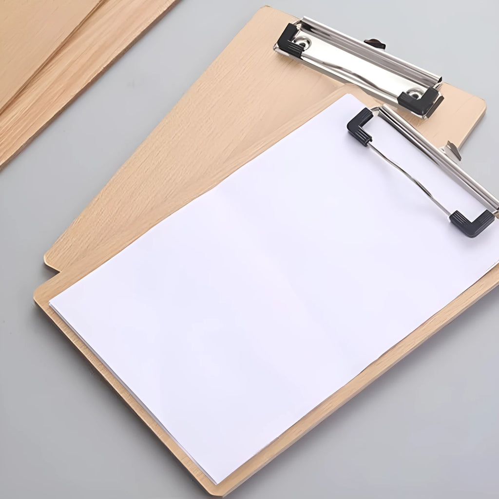 A4 wooden clipboard with metal clip and hanging hole placed on a desk
