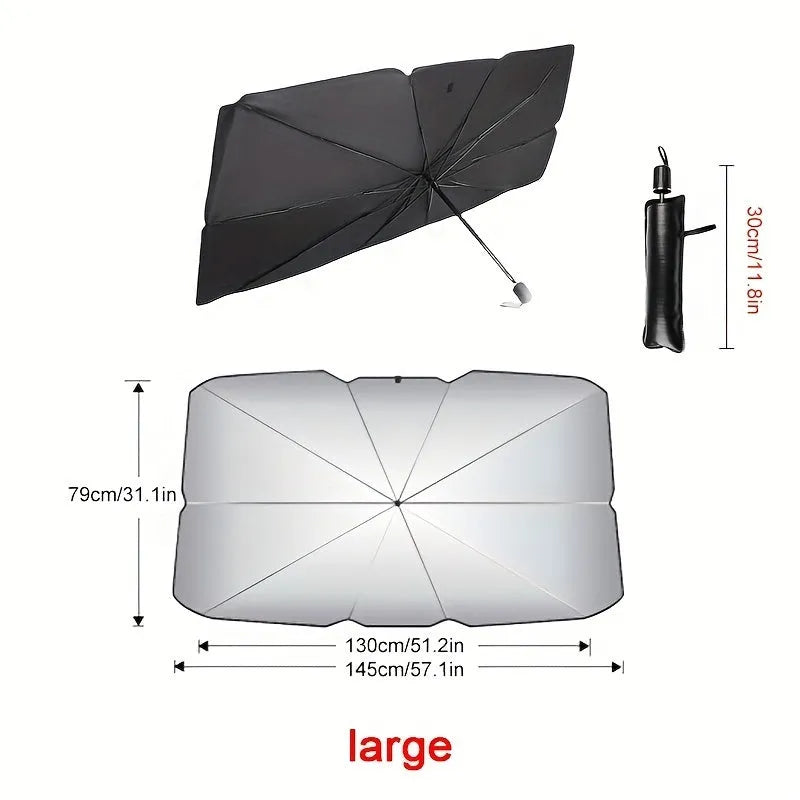 Open foldable car windshield sunshade umbrella placed against a car windscreen.