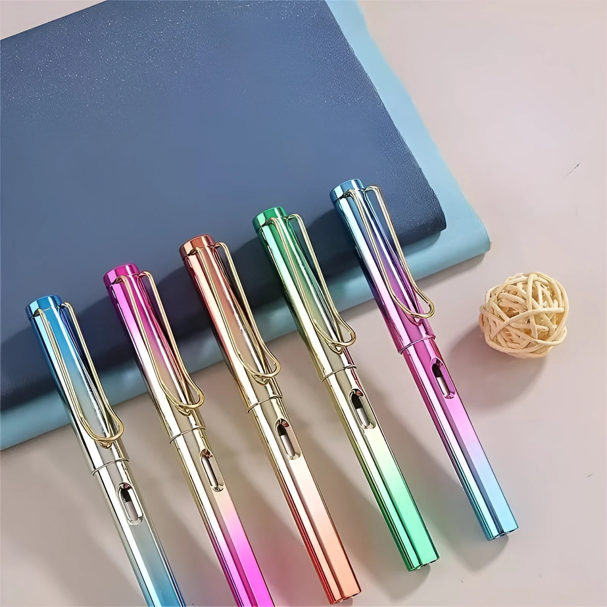 Portable eternal pencil in gold blue colour with hat cover on a table