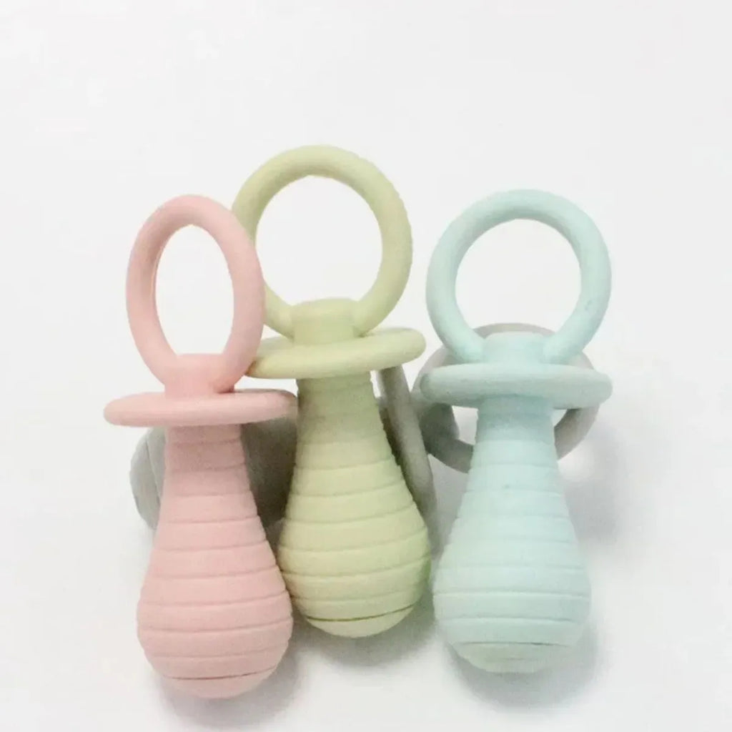Soft TPR pacifier chew toy for puppies and kittens in blue, with internal squeaker.