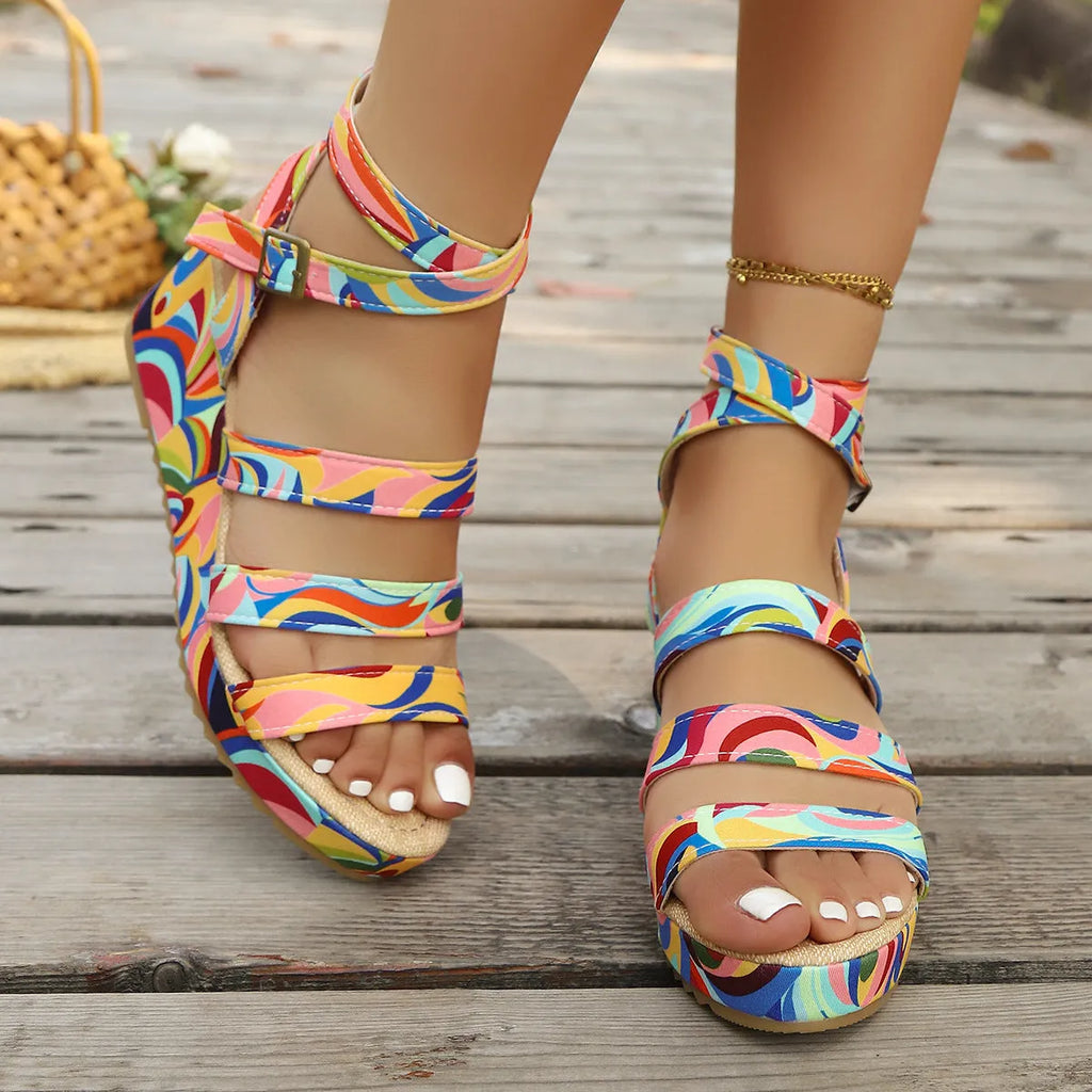 Women's lightweight buckle wedge sandals with fish mouth toe holder in a selected colour.