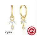 A pair of S925 sterling silver geometric sunflower earrings with inlaid golden-three diamonds zircon stones.