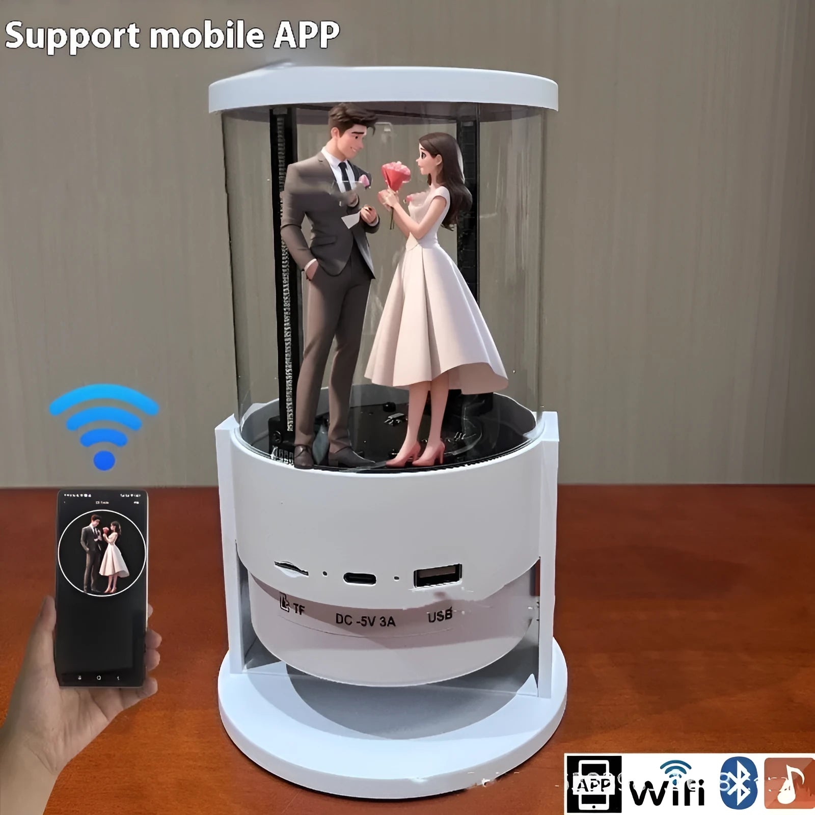 White 360-degree 3D holographic fan Bluetooth speaker with cylindrical screen on a desk