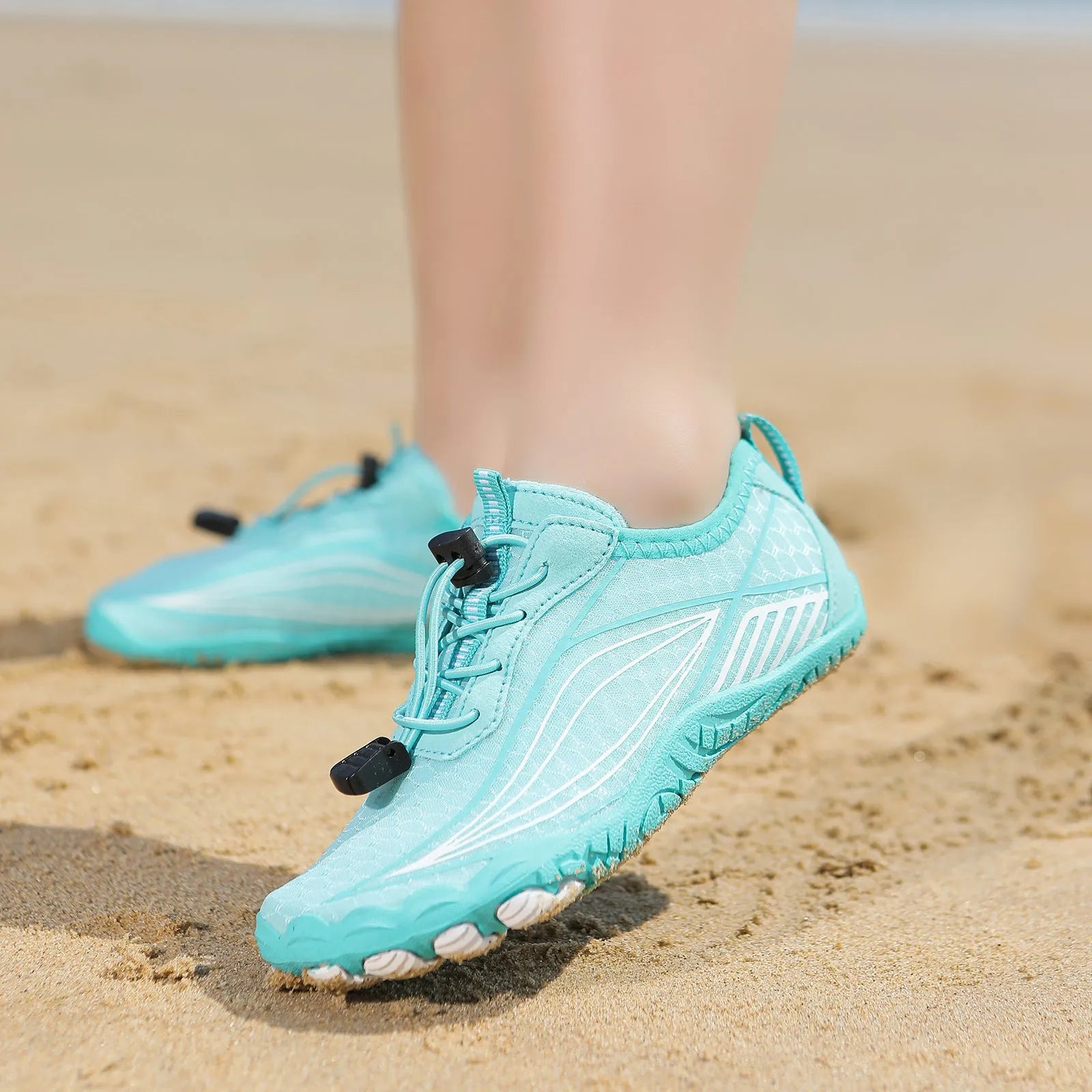 Children's black quick-dry water shoes with elastic band and rubber sole for outdoor swimming.