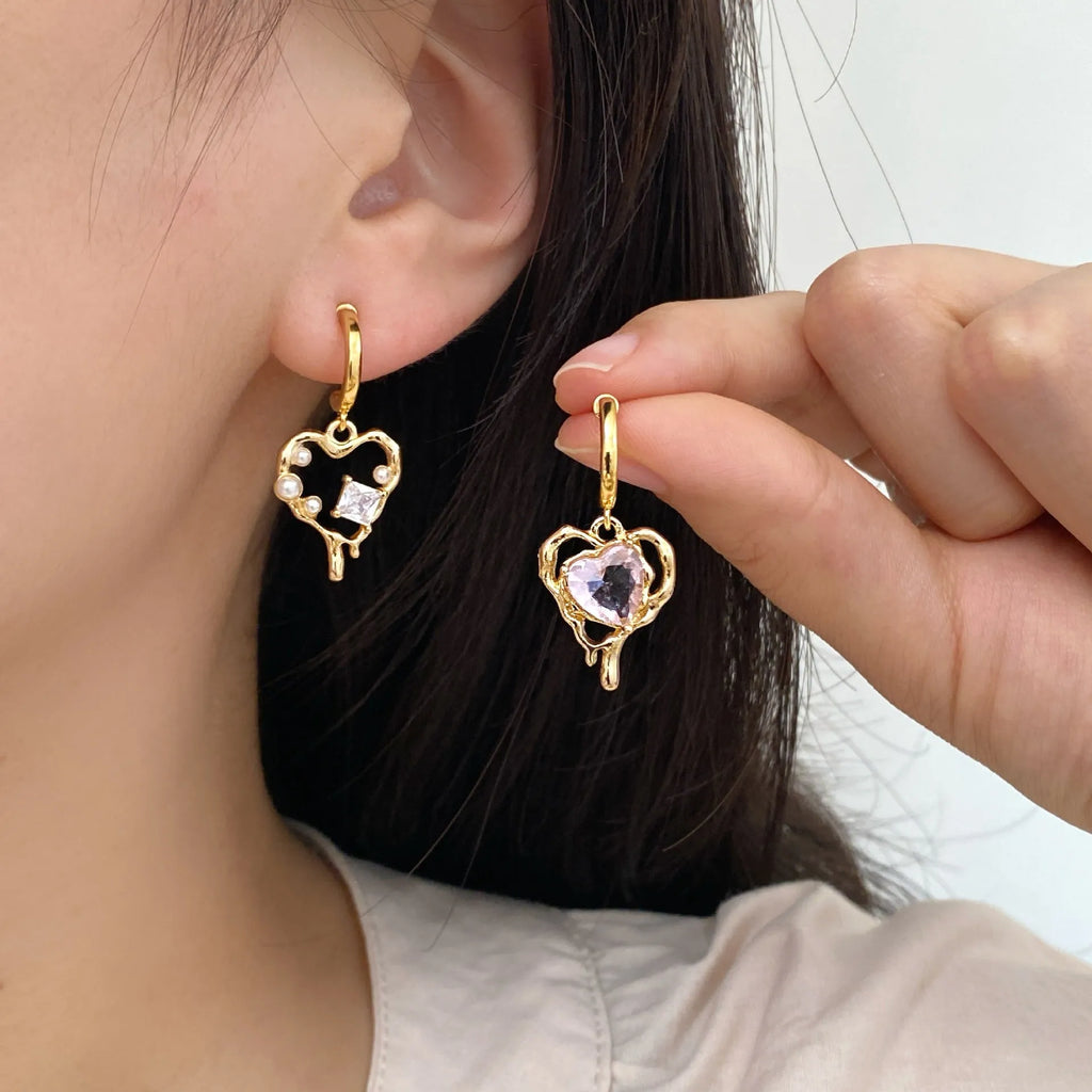 Asymmetric zircon and pearl earrings on copper heart base, light luxury style for women, available as ear clips or ear studs